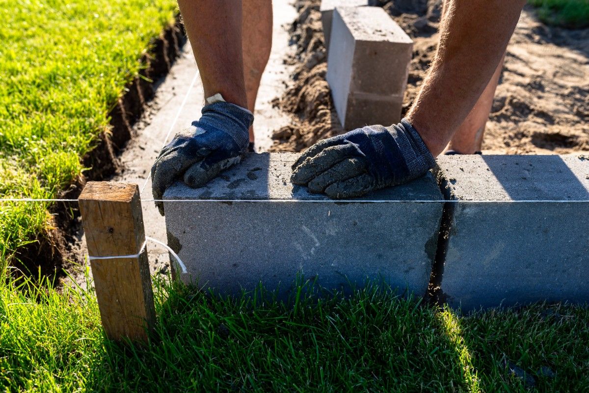 Fixing a leaning fence post with concrete reinforcement