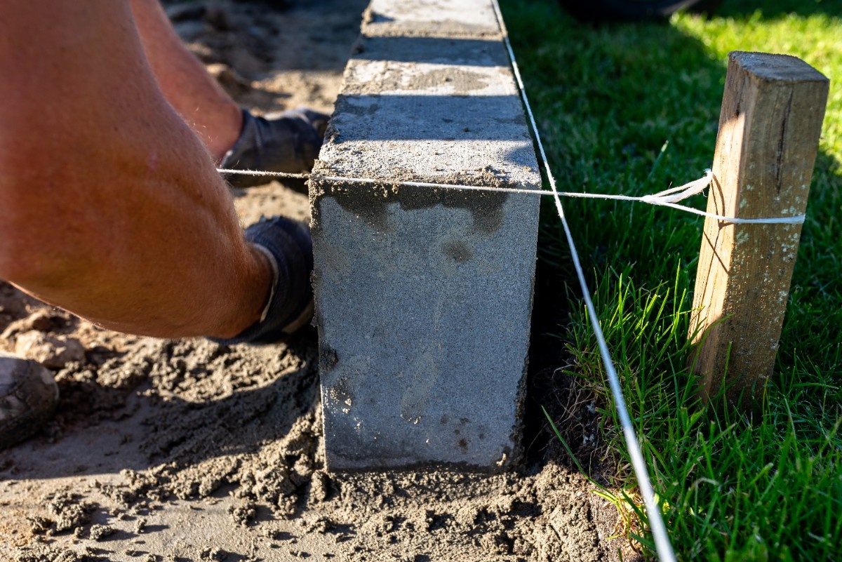 Wood fence longevity Pacific Northwest concrete post footing