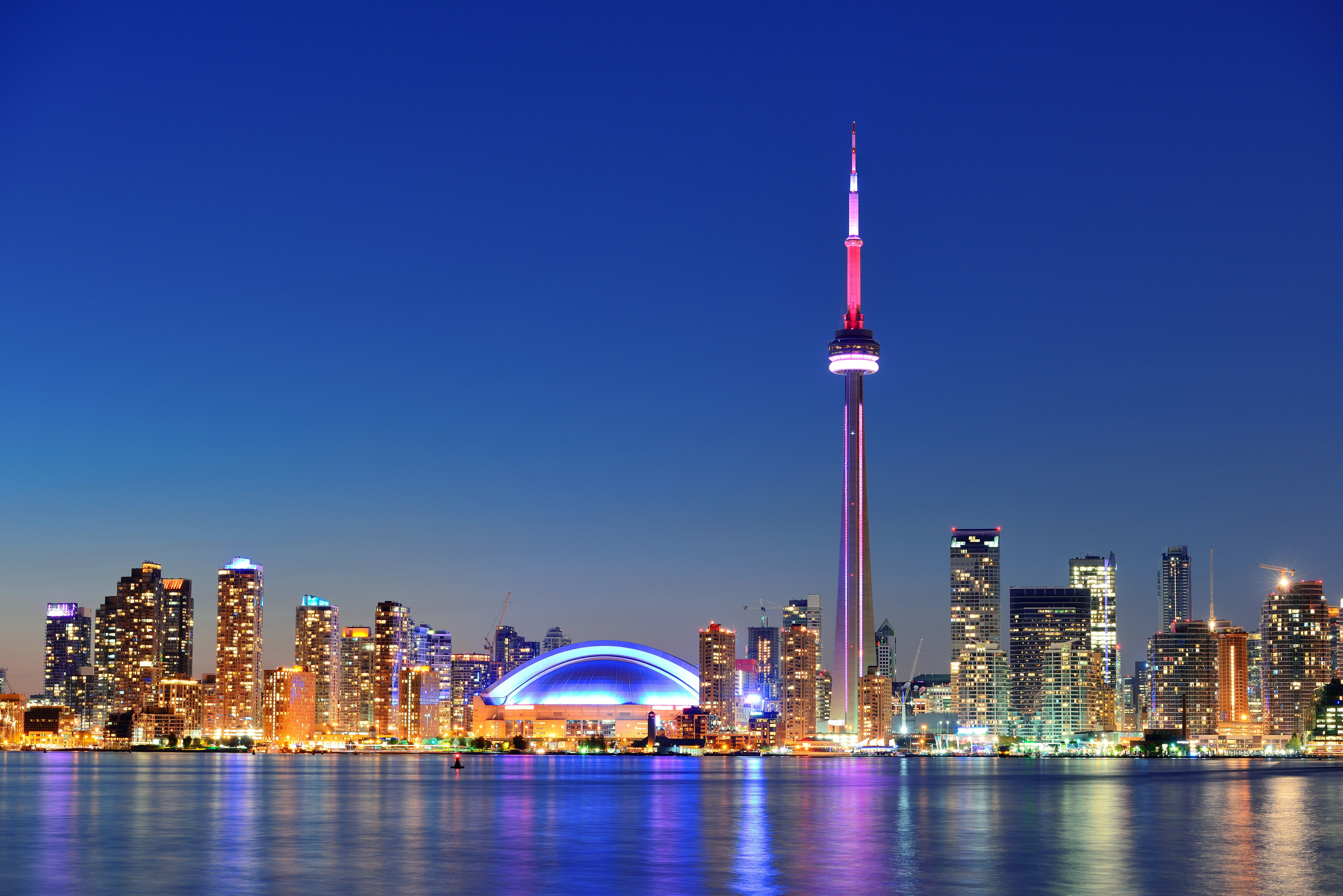 Toronto skyline with greetings in English, French, and Spanish, representing multilingual outreach