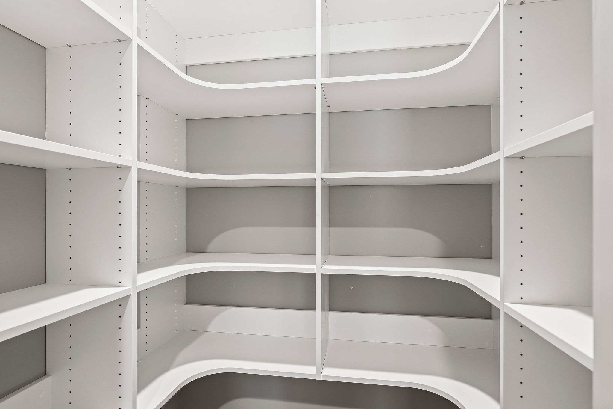 Large walk in pantry with electrical outlets to store additional kitchen appliances and keep your counters clutter free
