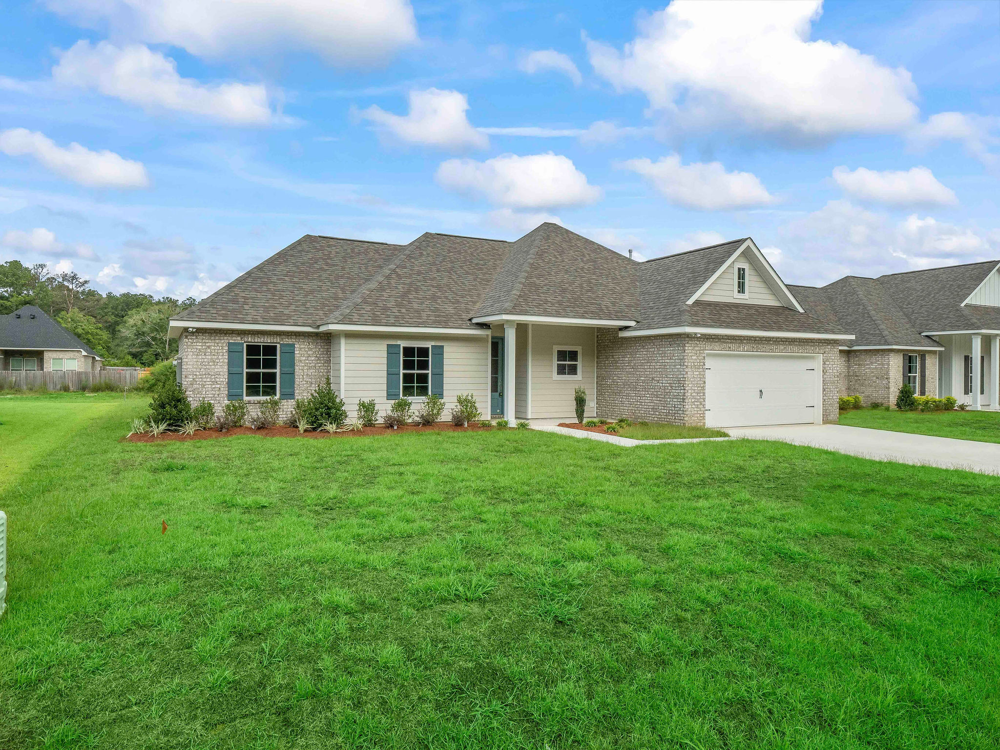 Large front yard with 2 car garage