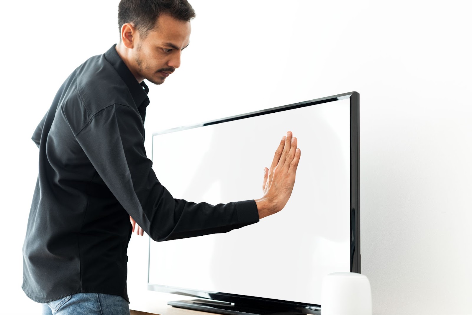 A technician standing in front of an interactive flat panel display for repair purpose