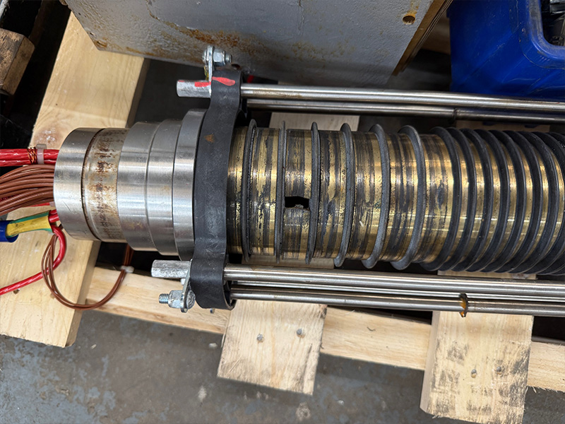 Worn slip ring collector rings with scoring and a damaged contact surface