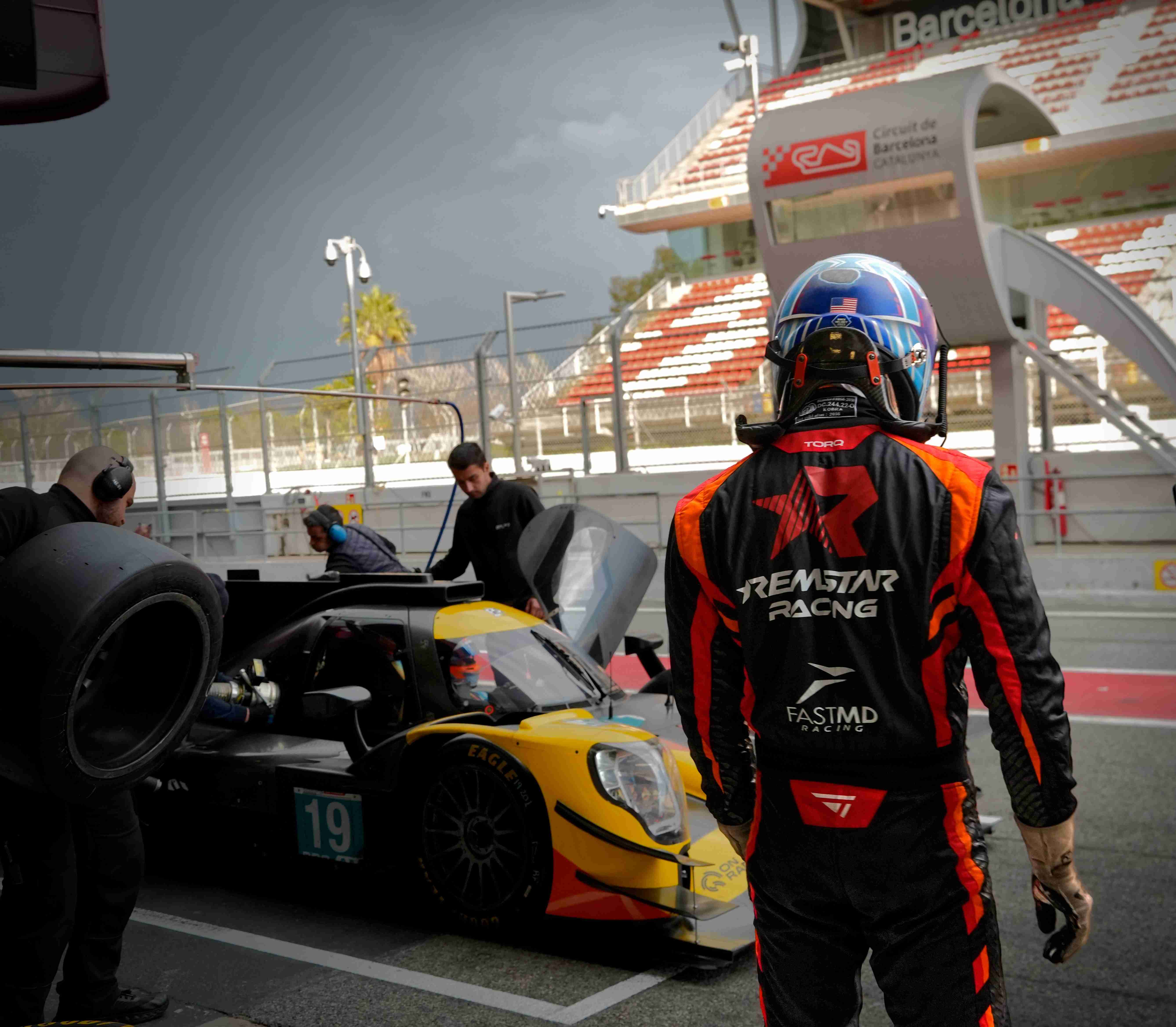 Remstar Racing team and driver preparing car in pit lane at Circuit de Barcelona