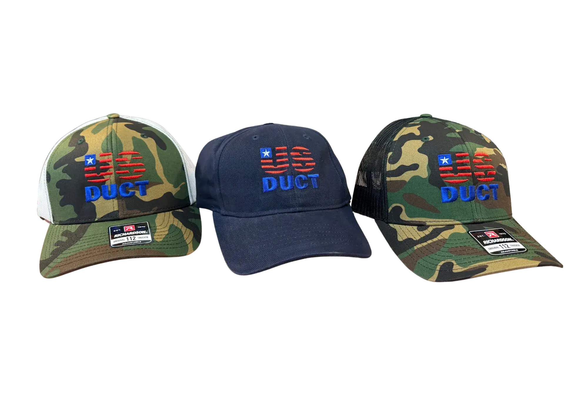 3 US Duct Hats. 2 camo with black netting, 1 navy blue, and 1 camo with white netting.
