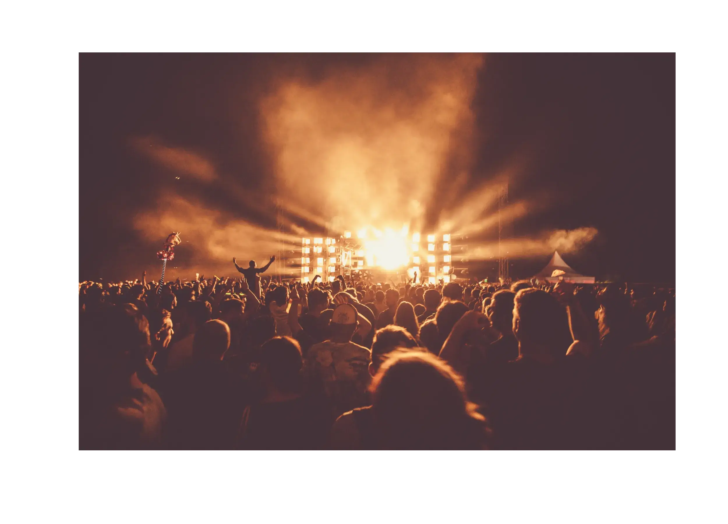 Concert with crowd and light show. 