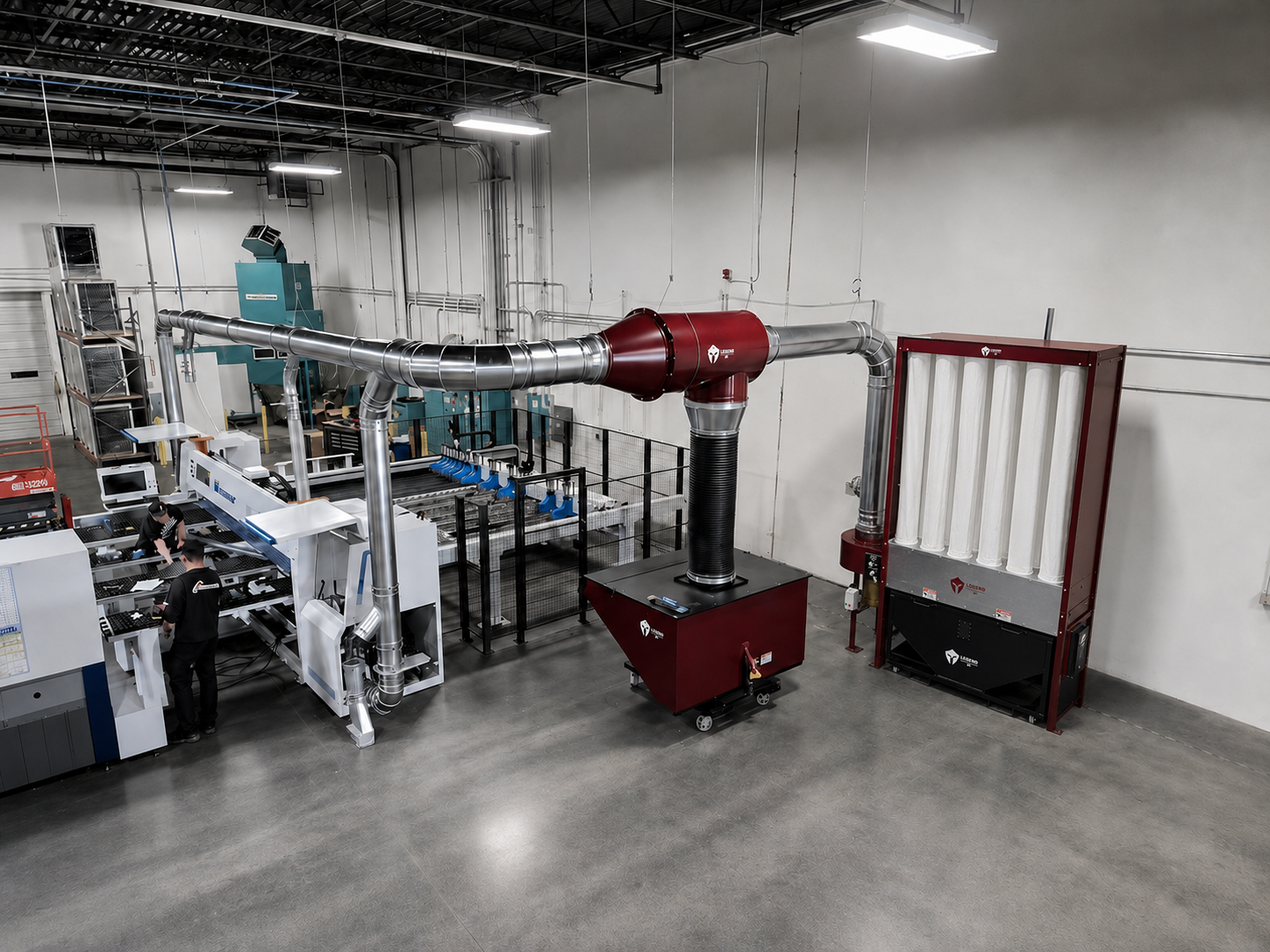 Industrial workspace with metal ducting, filtration units, and two workers operating machinery.