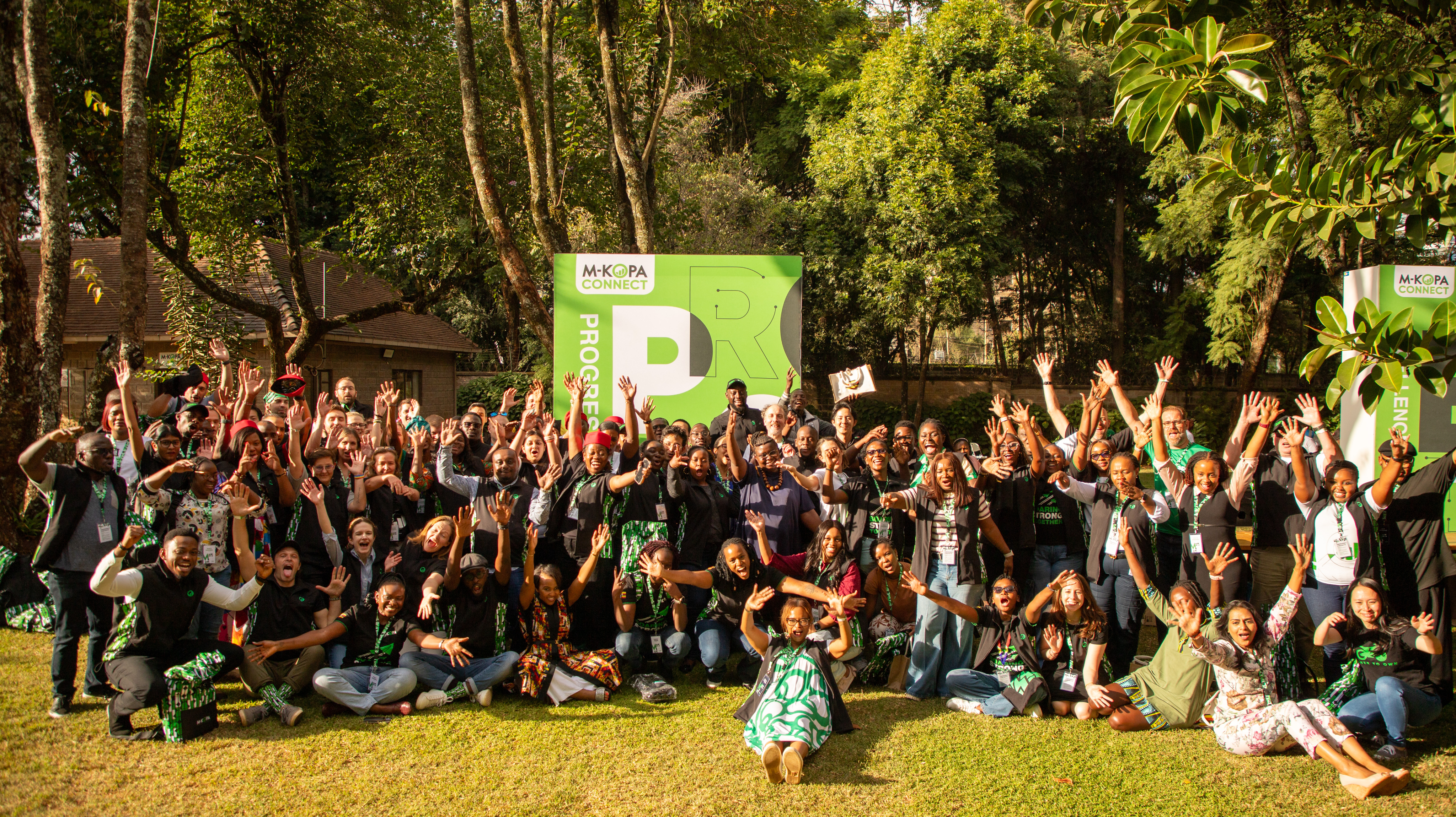 M-KOPA team gathered outdoors