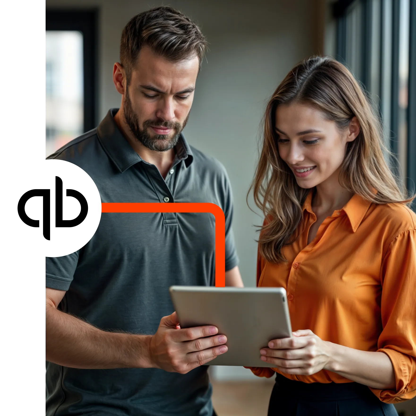 A man and a woman looking at a tablet computer.