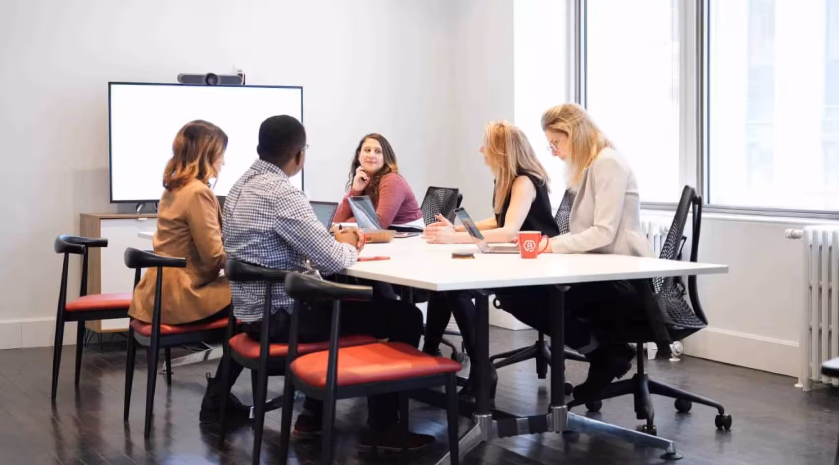a team working around a boardroom table