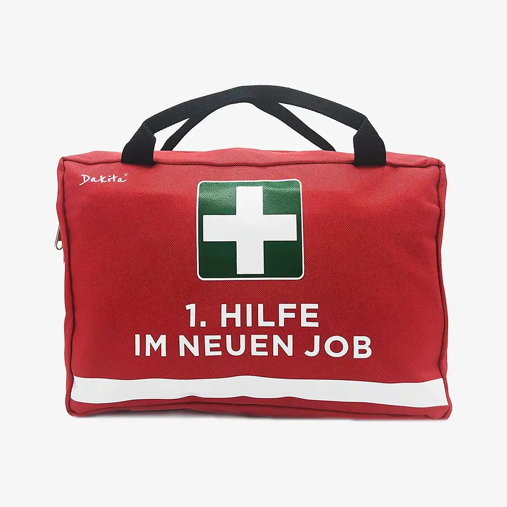 Rote Erste-Hilfe-Tasche mit weißem Kreuz, geöffnet mit sichtbaren Fächern und Inneneinteilung