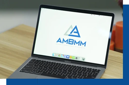 Macbook with AMBMM logo