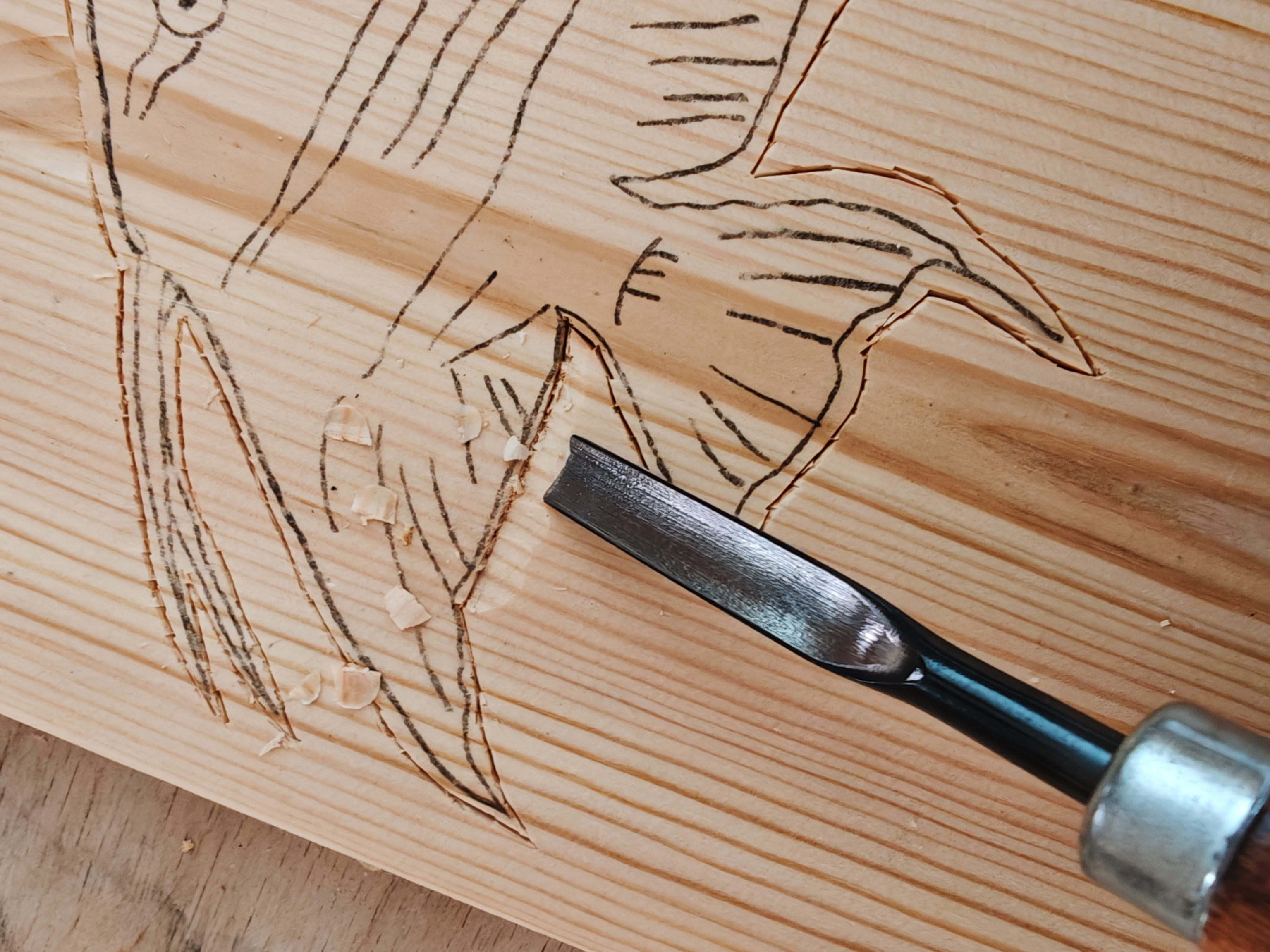 carving the wood to create the 3D effect