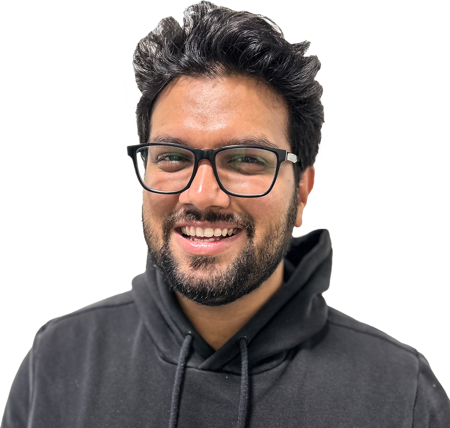 Smiling man with black hair, beard, and glasses wearing a black hoodie.