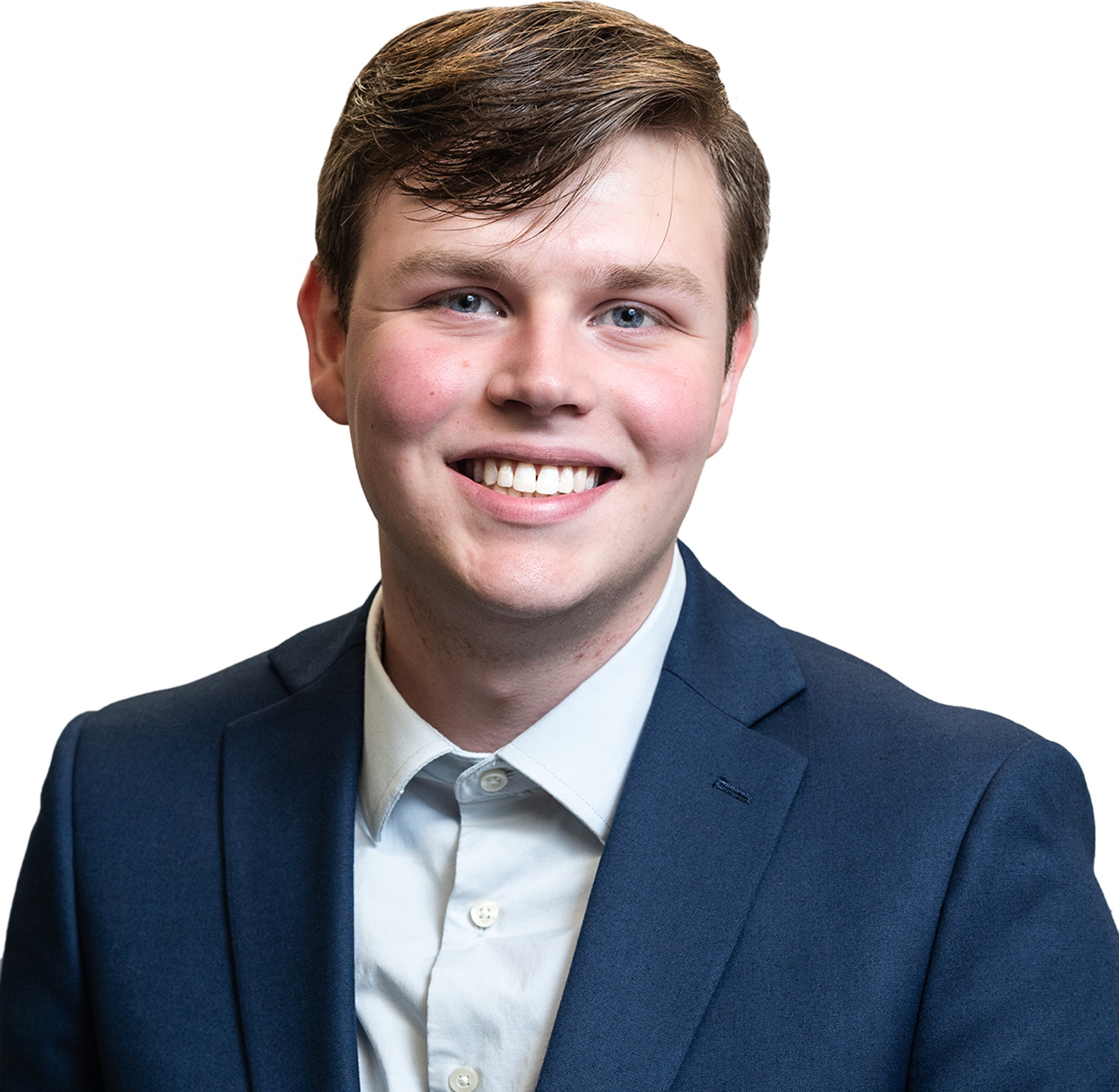Smiling young man with light skin, blue eyes, brown hair, wearing a navy blazer and light blue shirt.