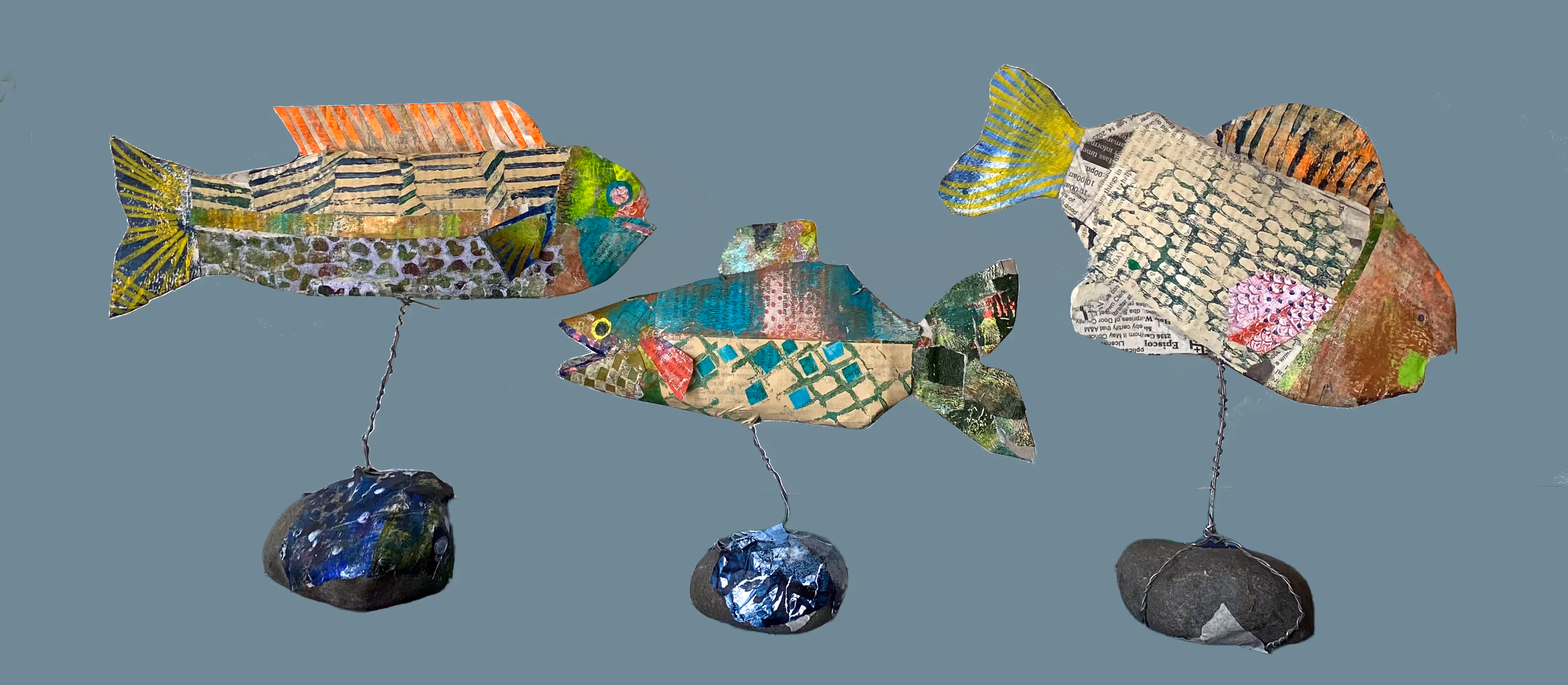 Photo of three fish collage sculptures