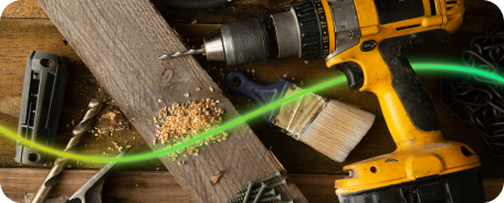 Various tools like a drill and paint brush