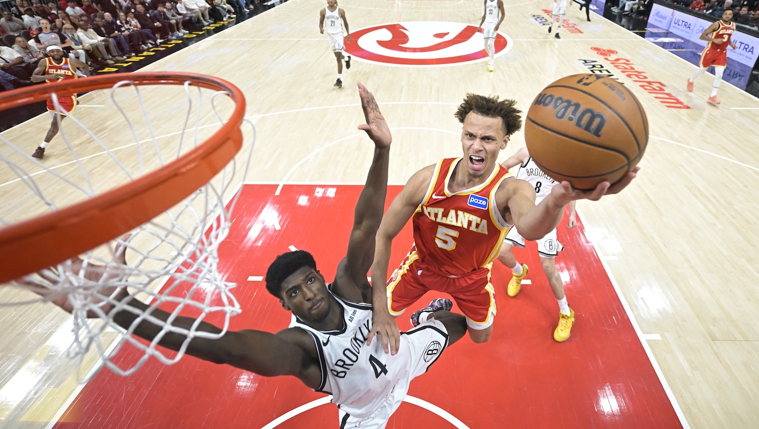 Daniels, Landale soar as Hawks claw out Nets win