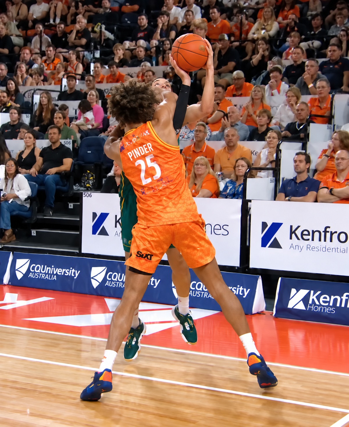 Cairns Taipans big man Keanu Pinder clearly comes down Dakota Mathias' during three point attempt