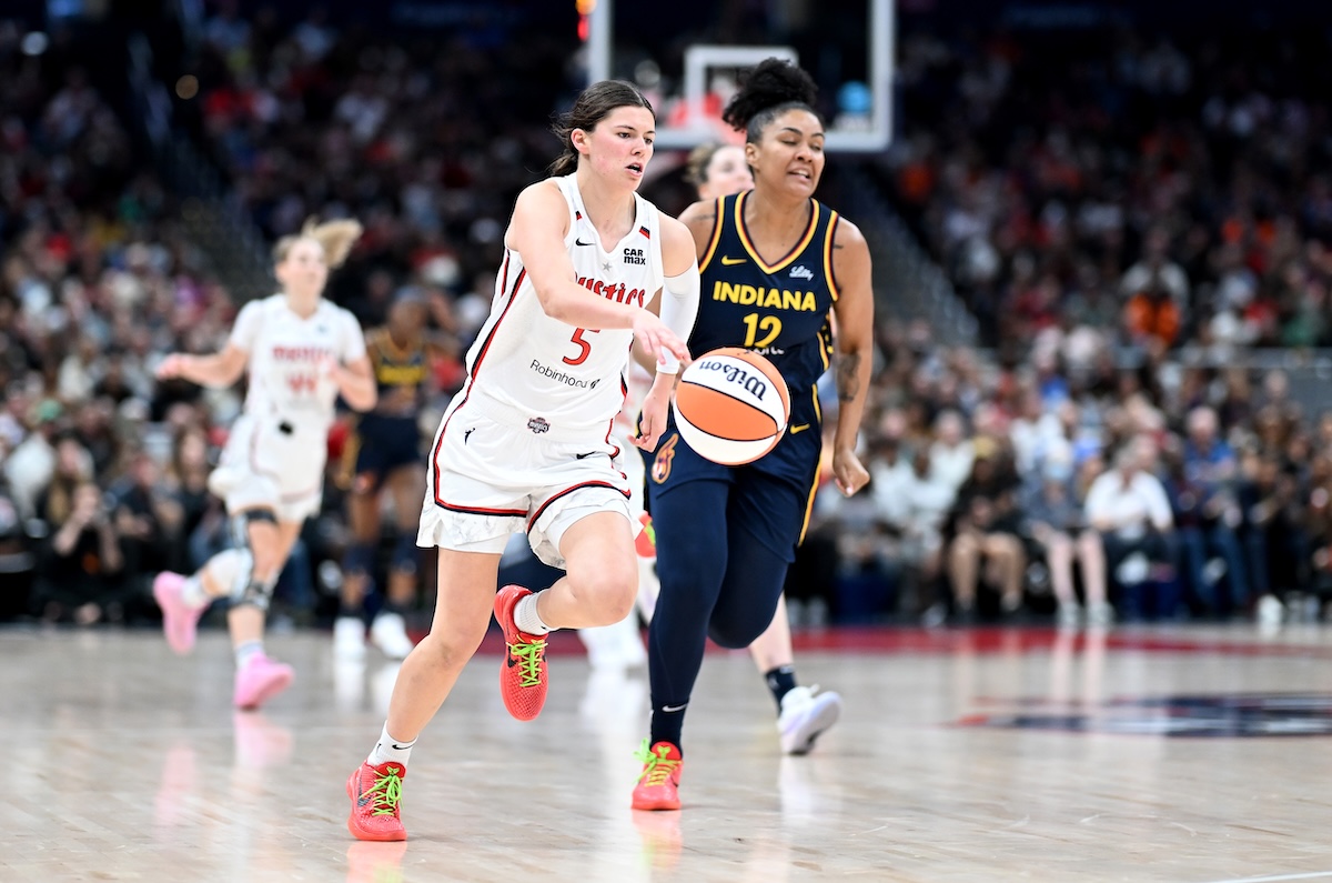 Mystics guard Jade Melbourne pushes the ball past Damiris Dantas against the Indiana Fever at Capital One Arena in Washington on September 19, 2024.