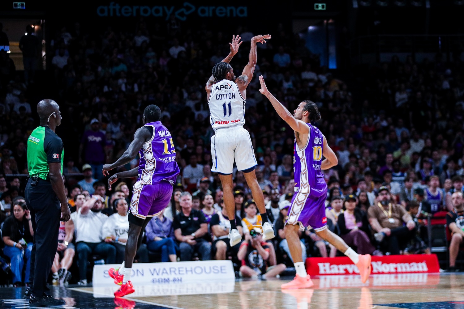 36ers guard Bryce Cotton shoots over Australian forward Xavier Cooks of the Sydney Kings at Afterpay Arena in Sydney on October 11, 2026