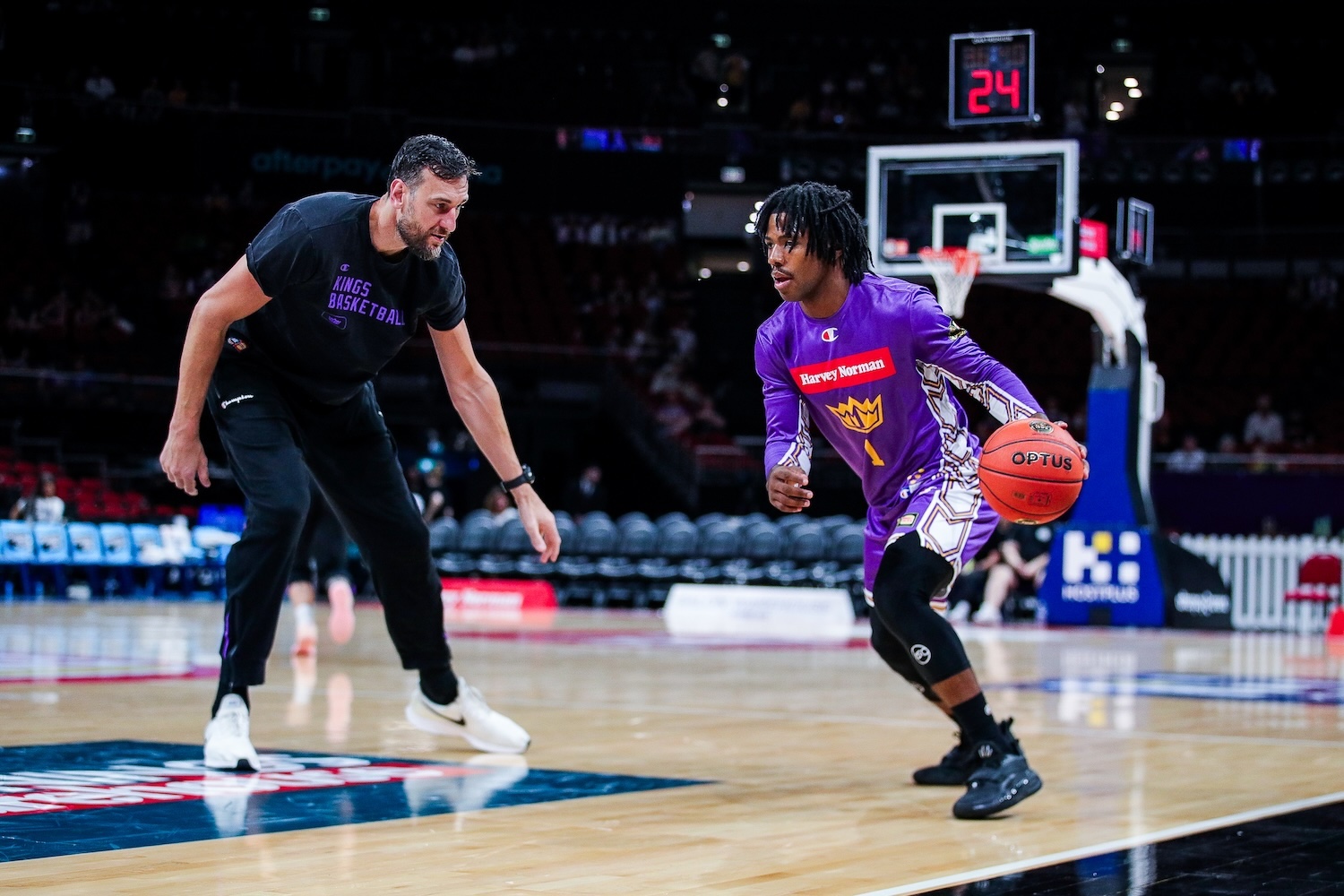 Kings guard Kendric Davis warms up against assistant coach Andrew Bogut before the game against the Adelaide 36ers at Afterpay Arena in Sydney on October 11, 2026