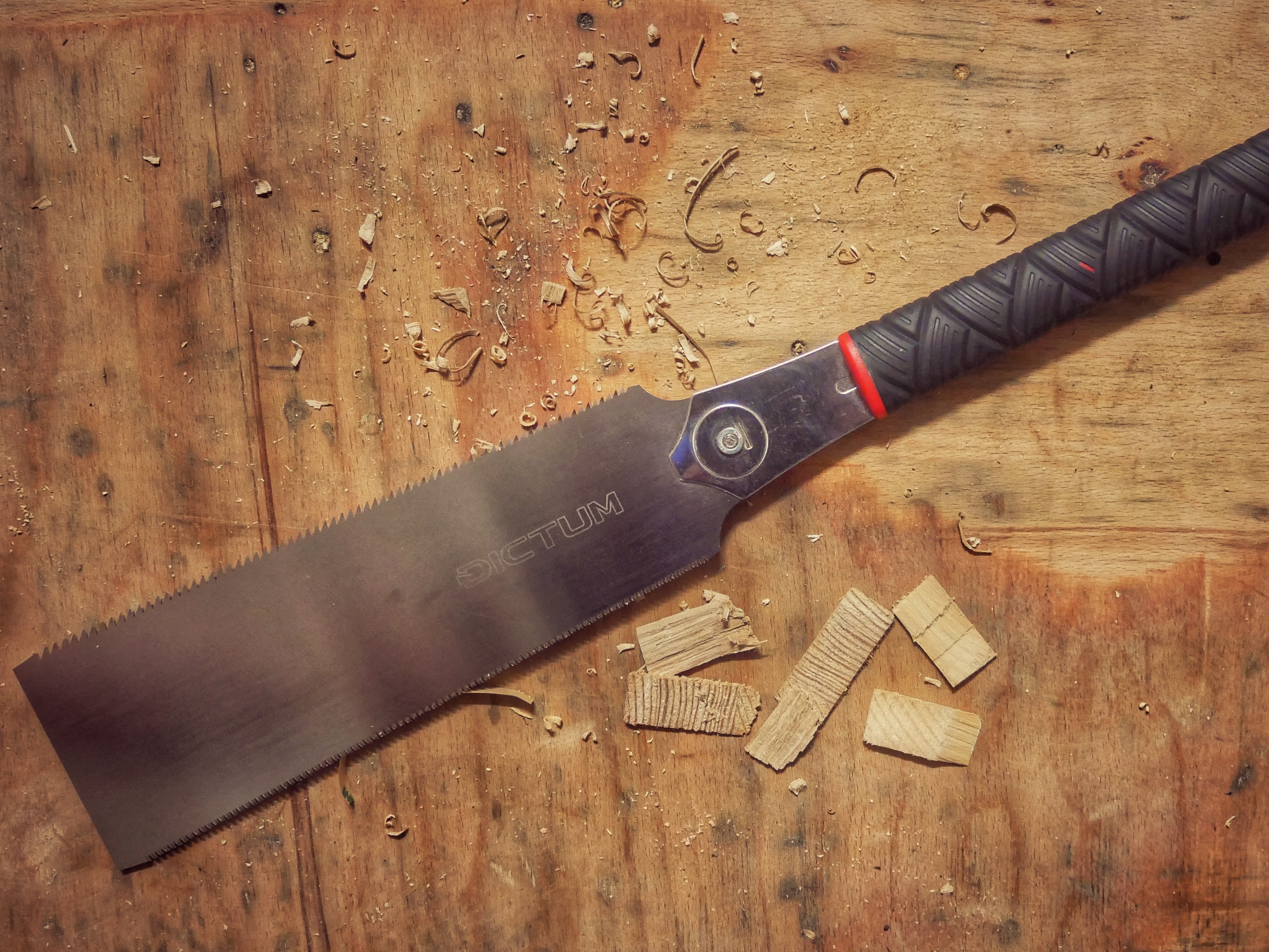 Close-up of a handsaw for wood, demonstrating essential woodworking hand tools for DIY projects.