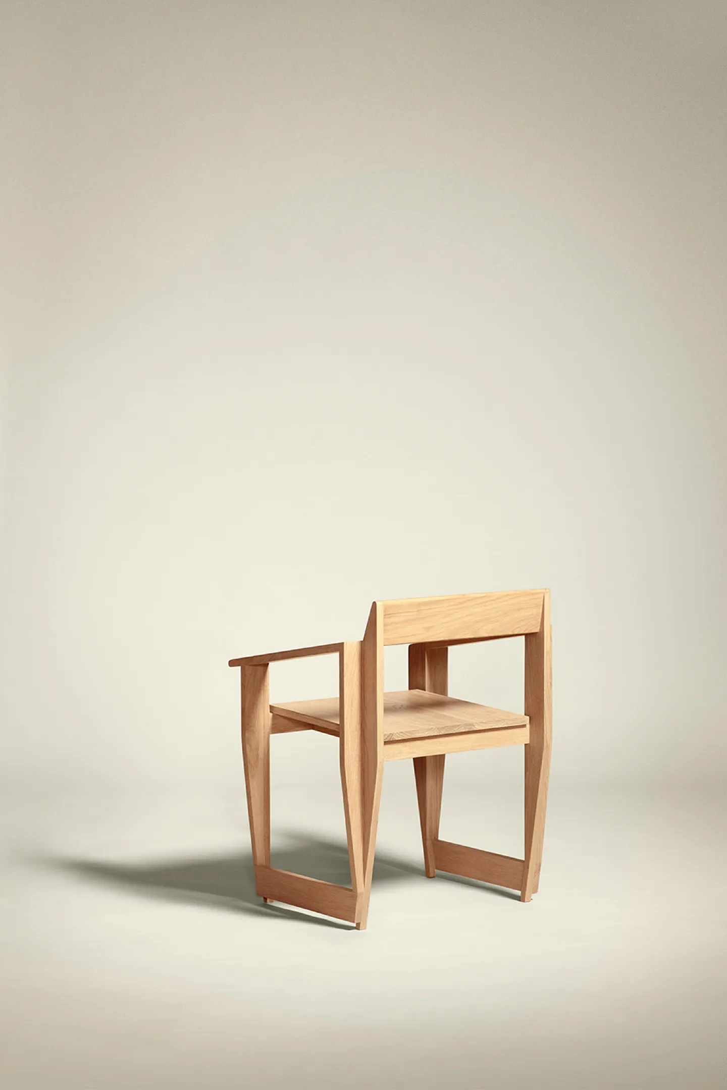 Minimalist wooden chair with open sides on a plain light background.