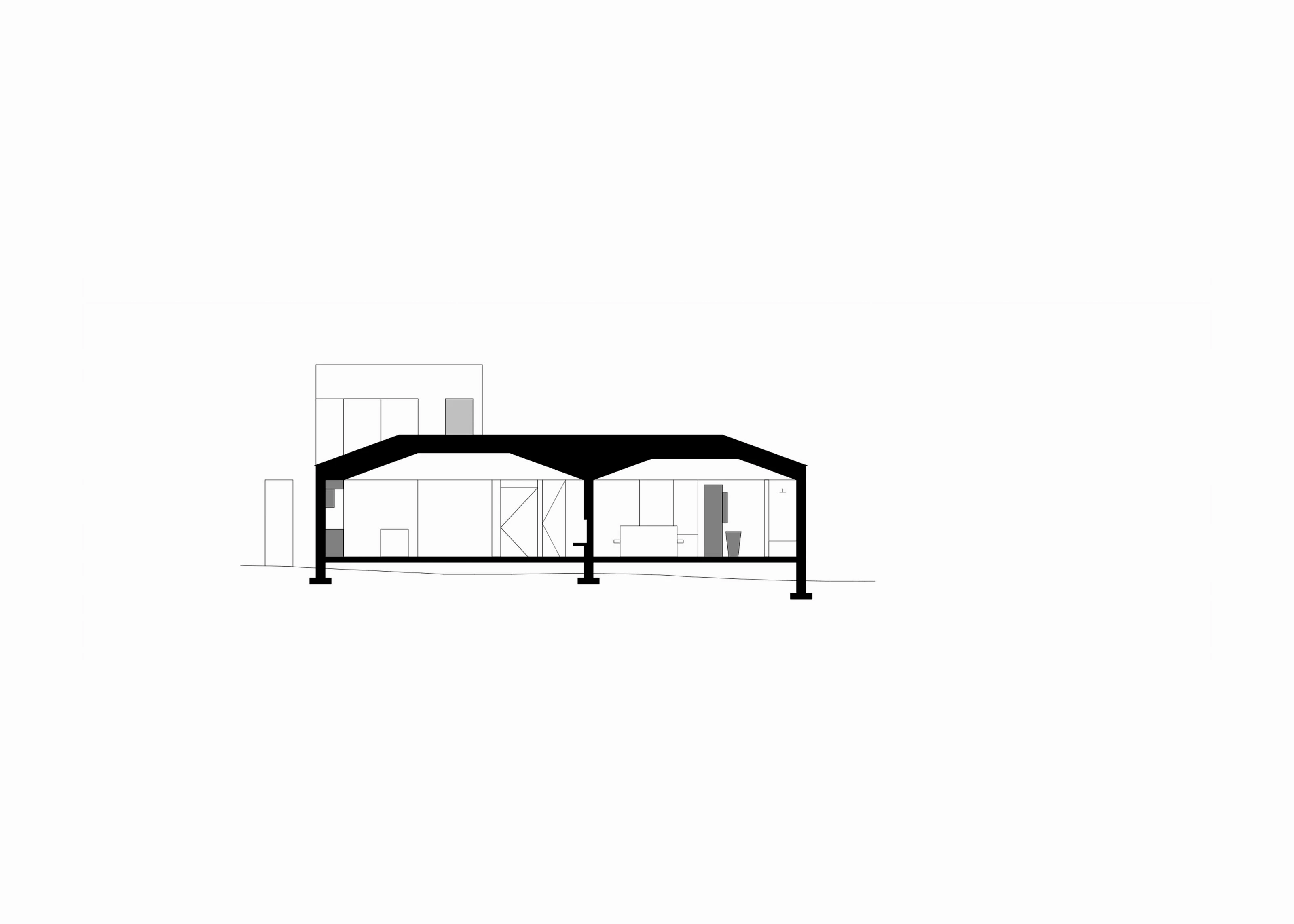 Black and white architectural cross-section of a modern two-room building with slanted roof.