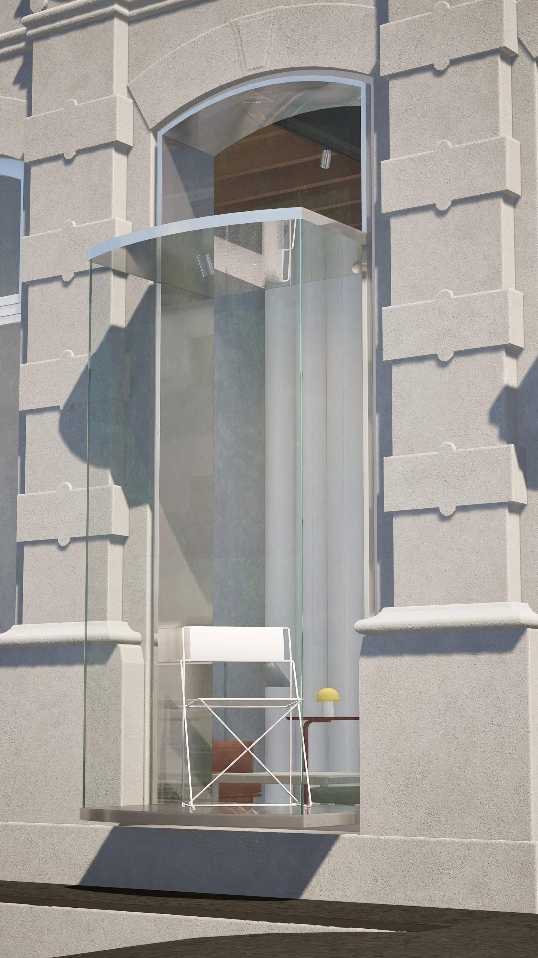 White modern chair and small table with a yellow lamp inside a curved glass balcony on a beige building.