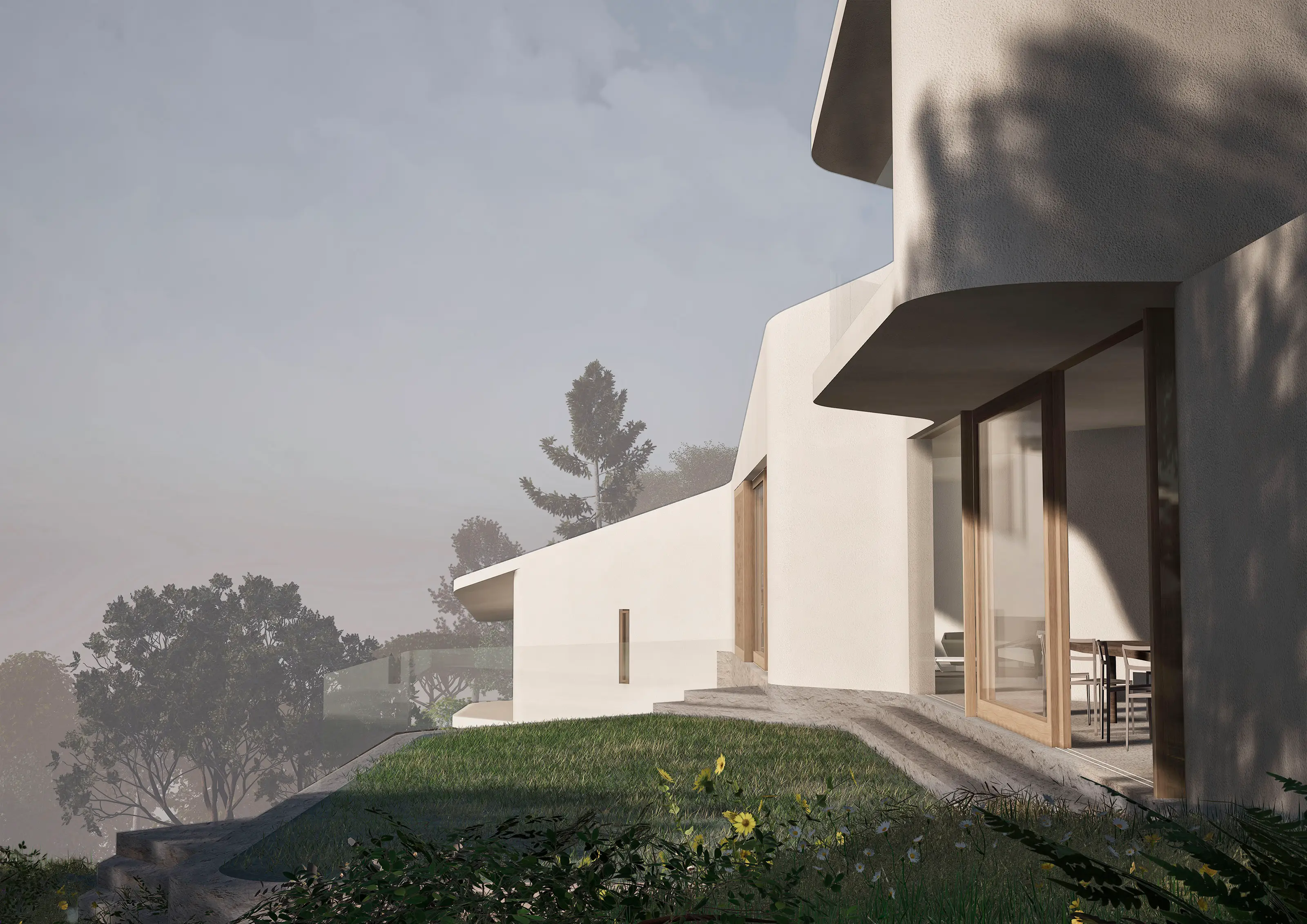 Modern white house with large glass doors opening to grass and plants on a misty day.