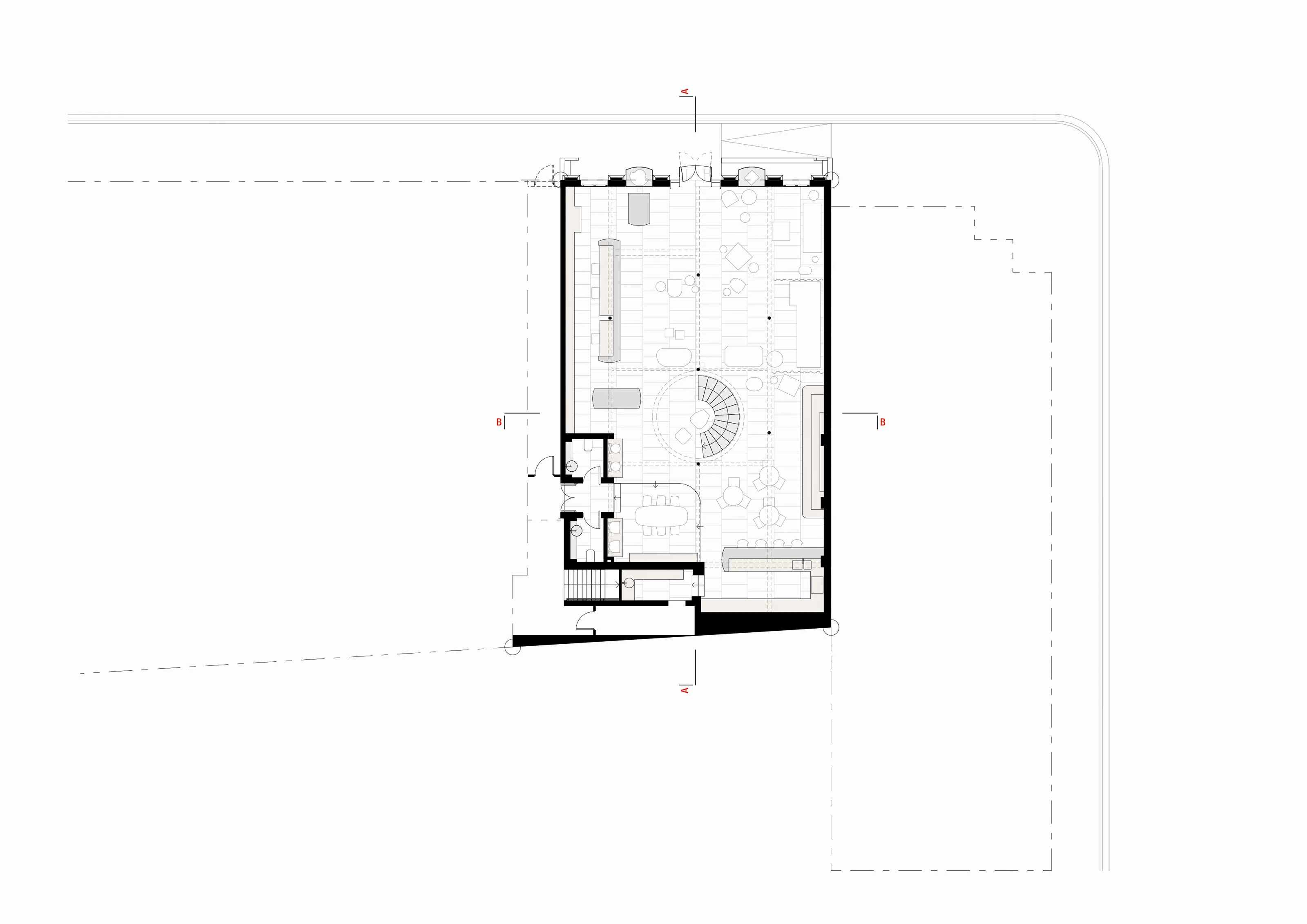 Architectural floor plan of a building's ground floor with rooms, furniture, and staircases detailed.