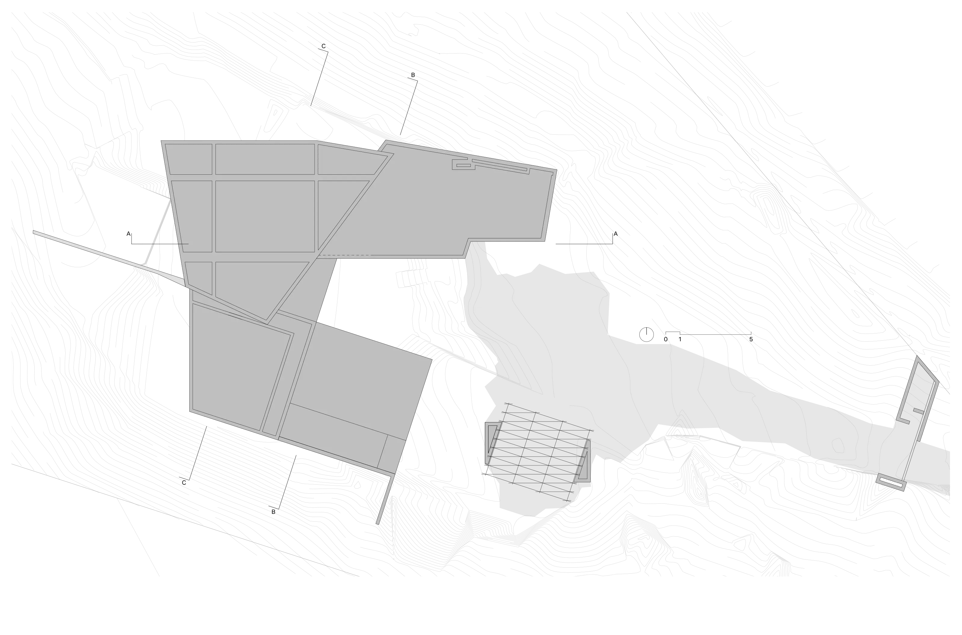 Topographical map showing building footprints and contour lines on varied terrain.