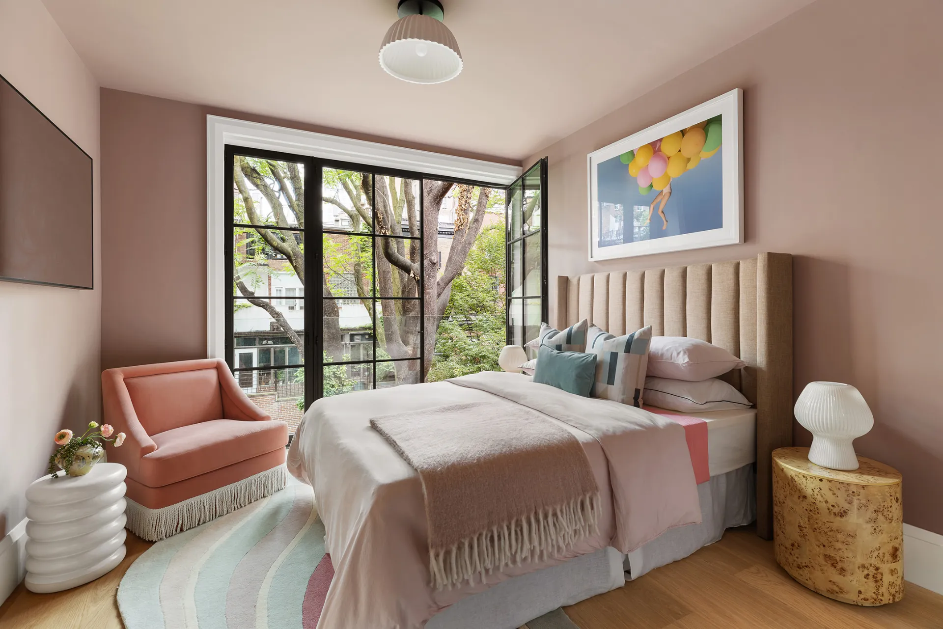 pink bedroom with large windows 