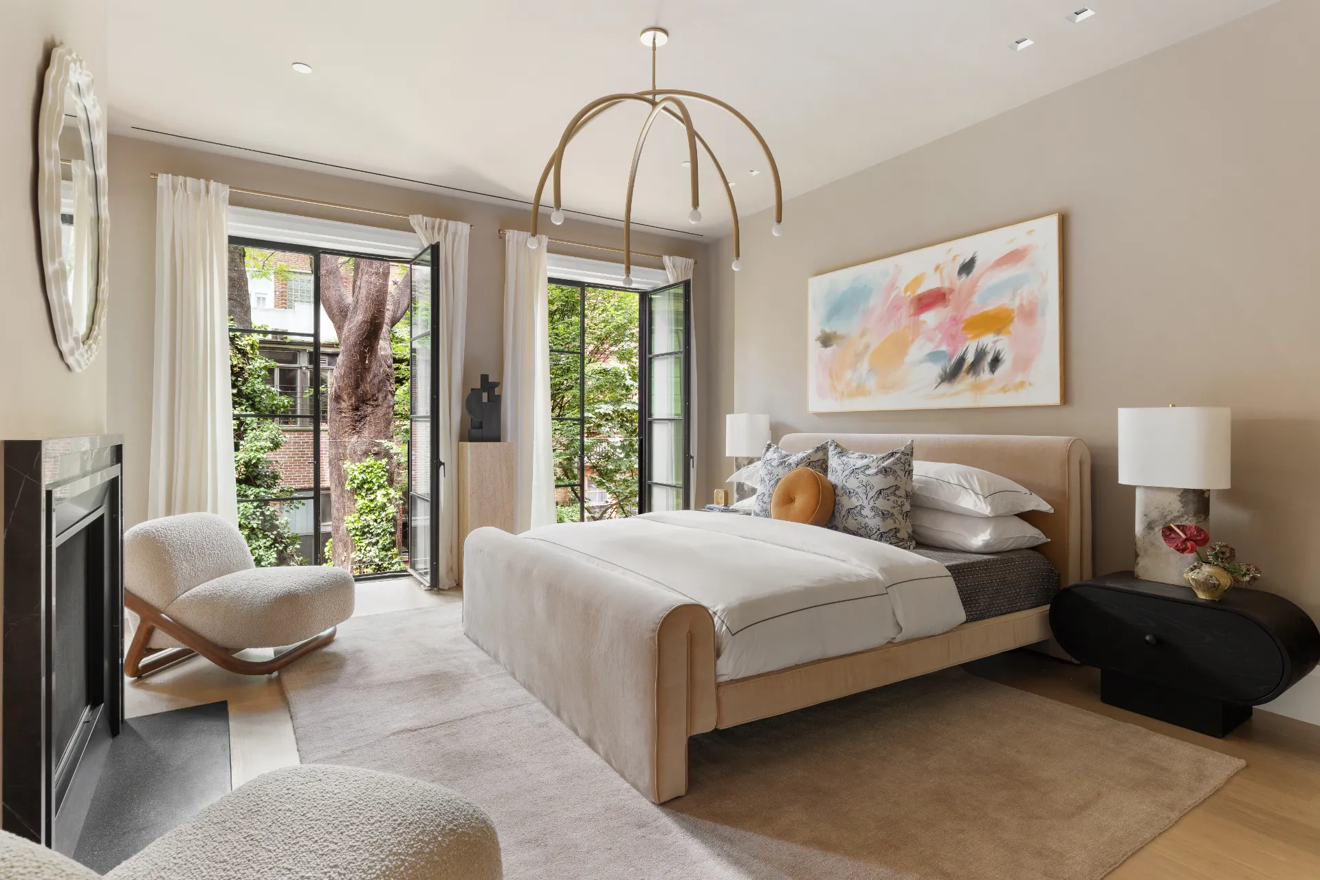 primary bedroom with chandelier and large windows