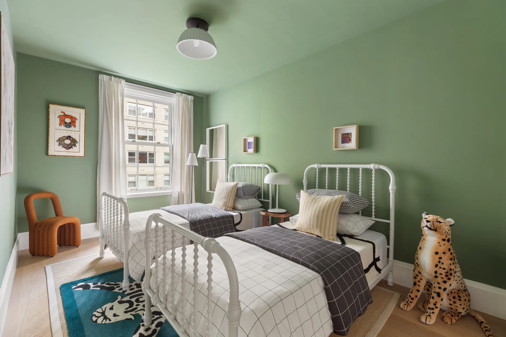 green bedroom with stuffed animals