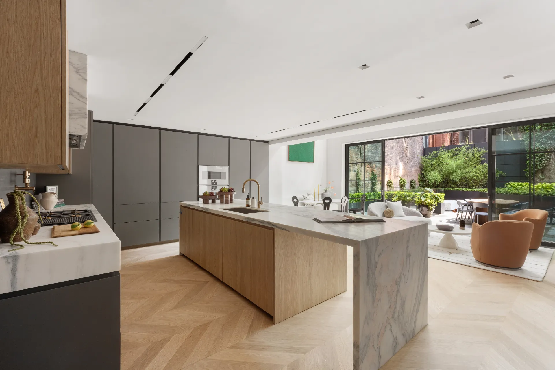 kitchen with marble island looking out onto garden