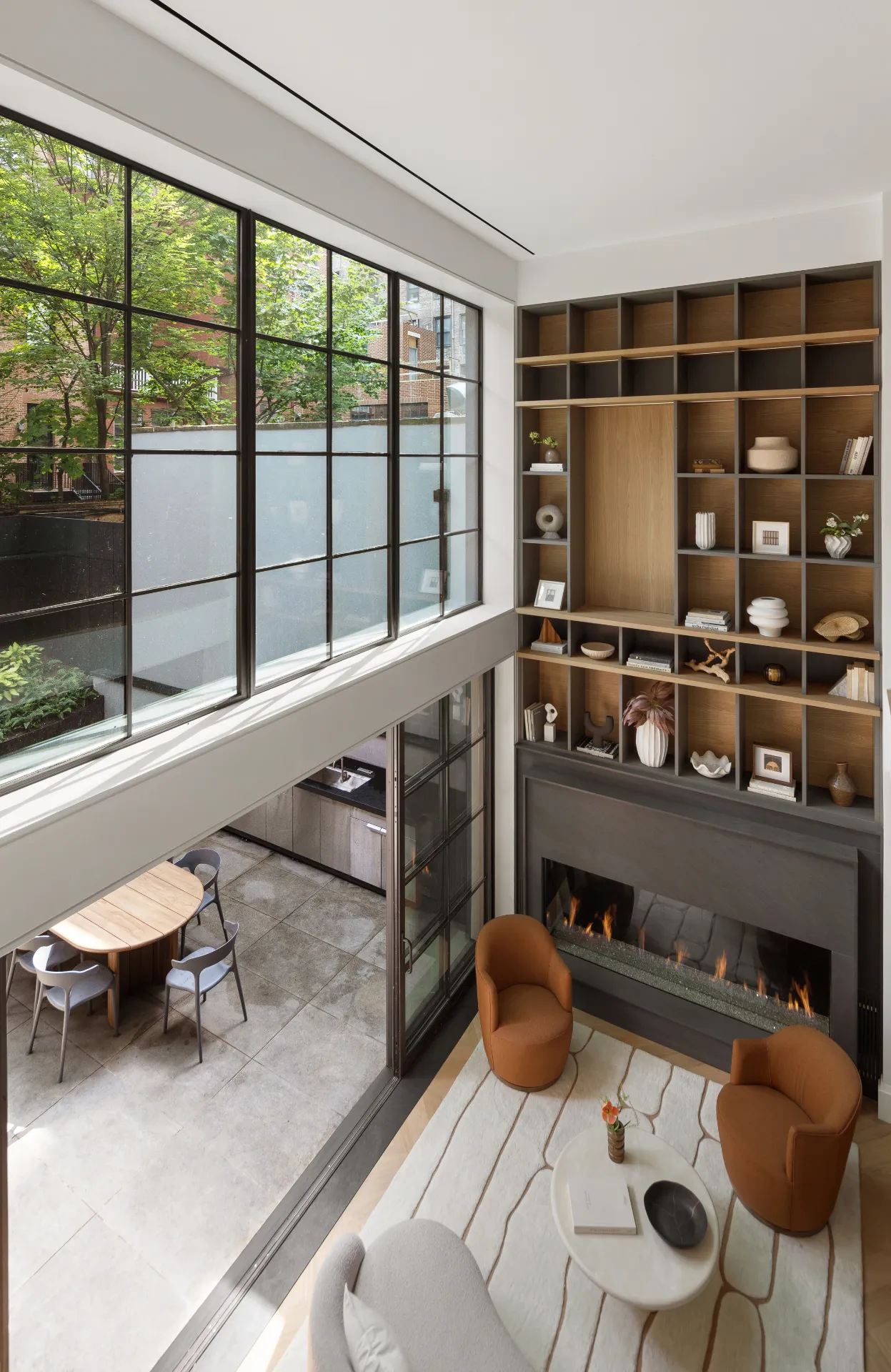 View of bookcase and large garden window in den from balcony