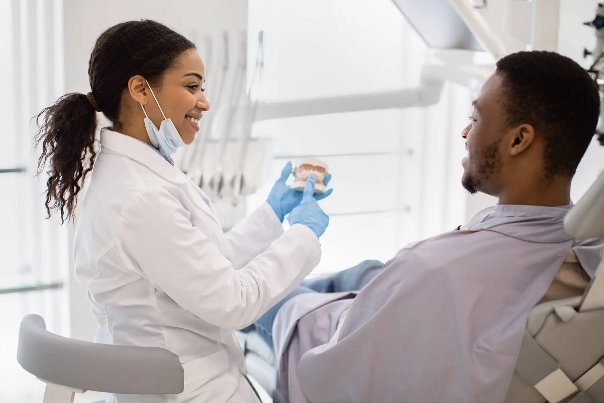 Dentist discussing dental implants with patient