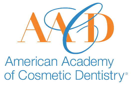 Stylized overlapping letters A A C D in orange and blue, with text American Academy of Cosmetic Dentistry below.