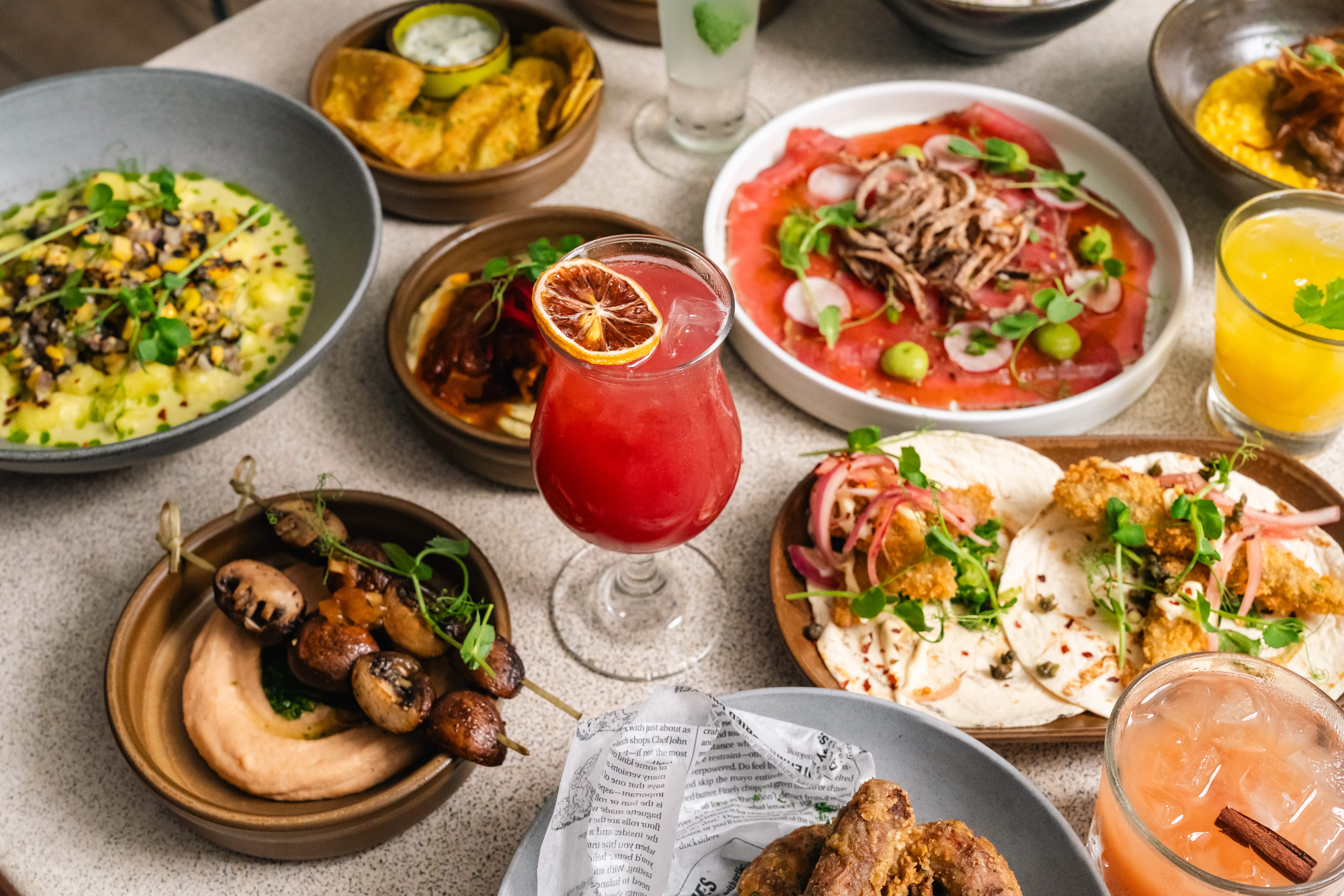 tabletop with spread of food and drinks from barbados