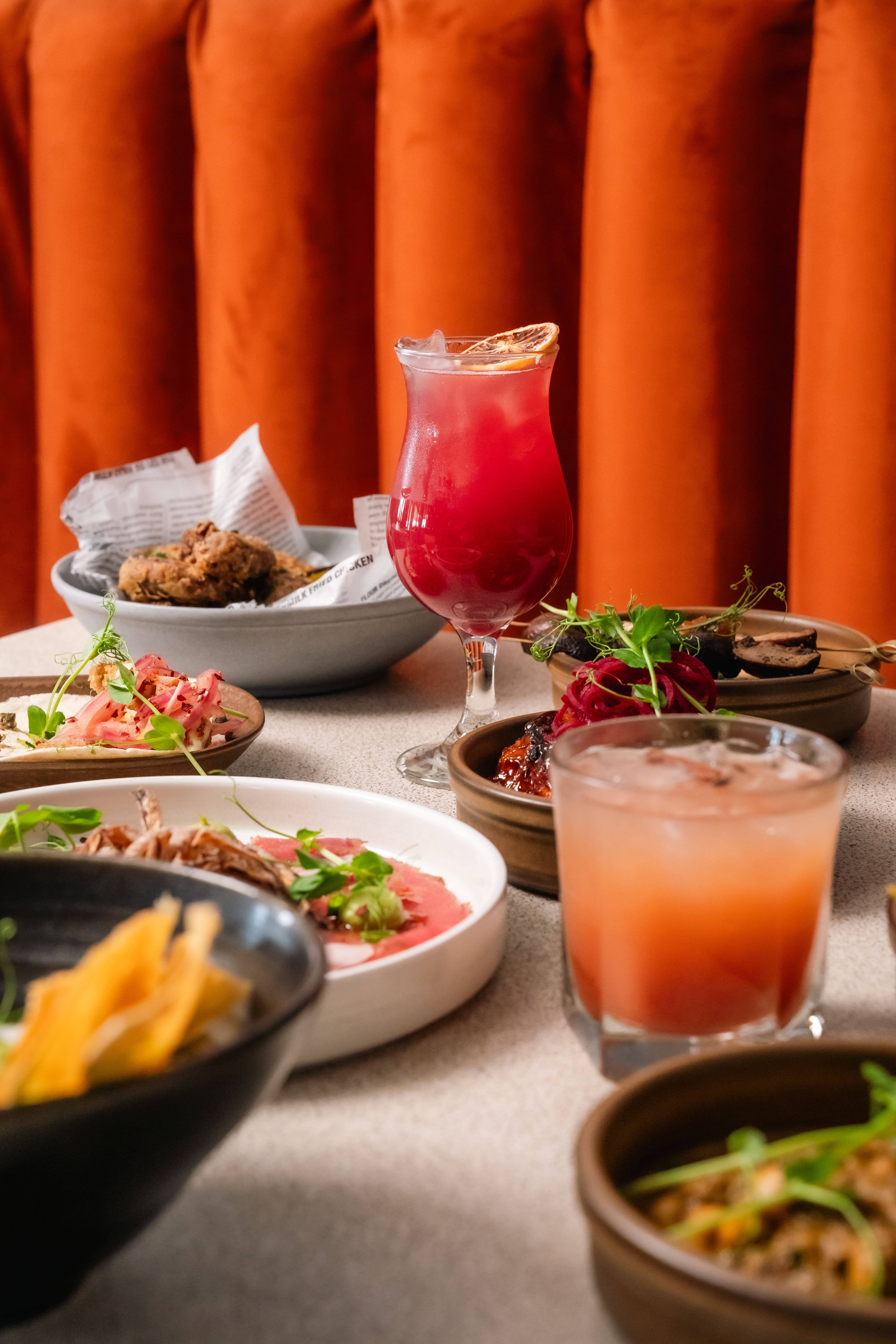 table full of Caribbean food and drinks