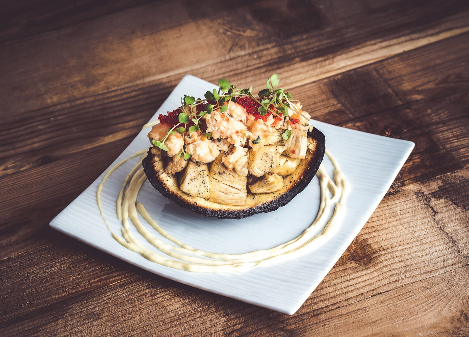 lobster dish on white plate