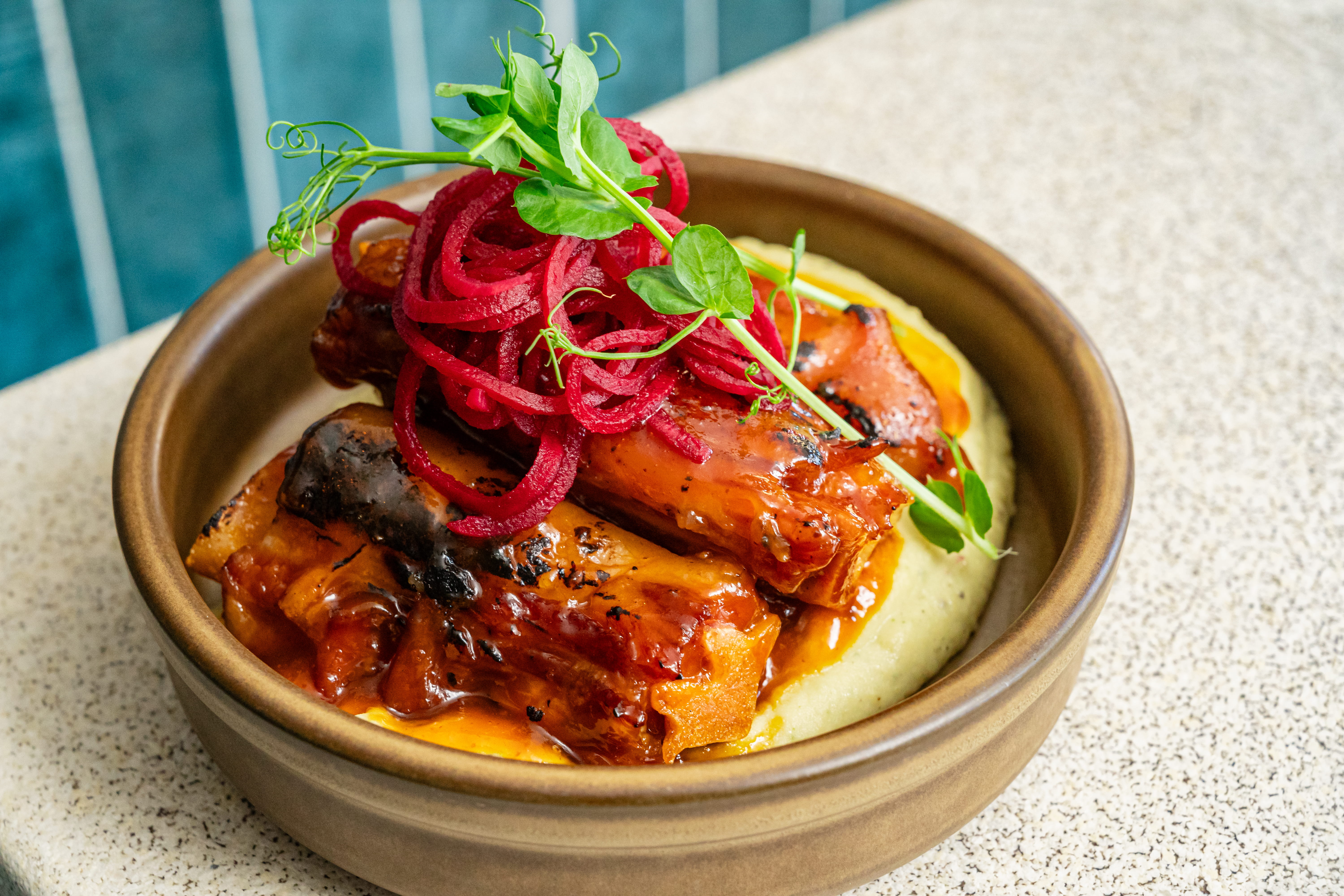Barbados dish with sauce plated on a tabletop