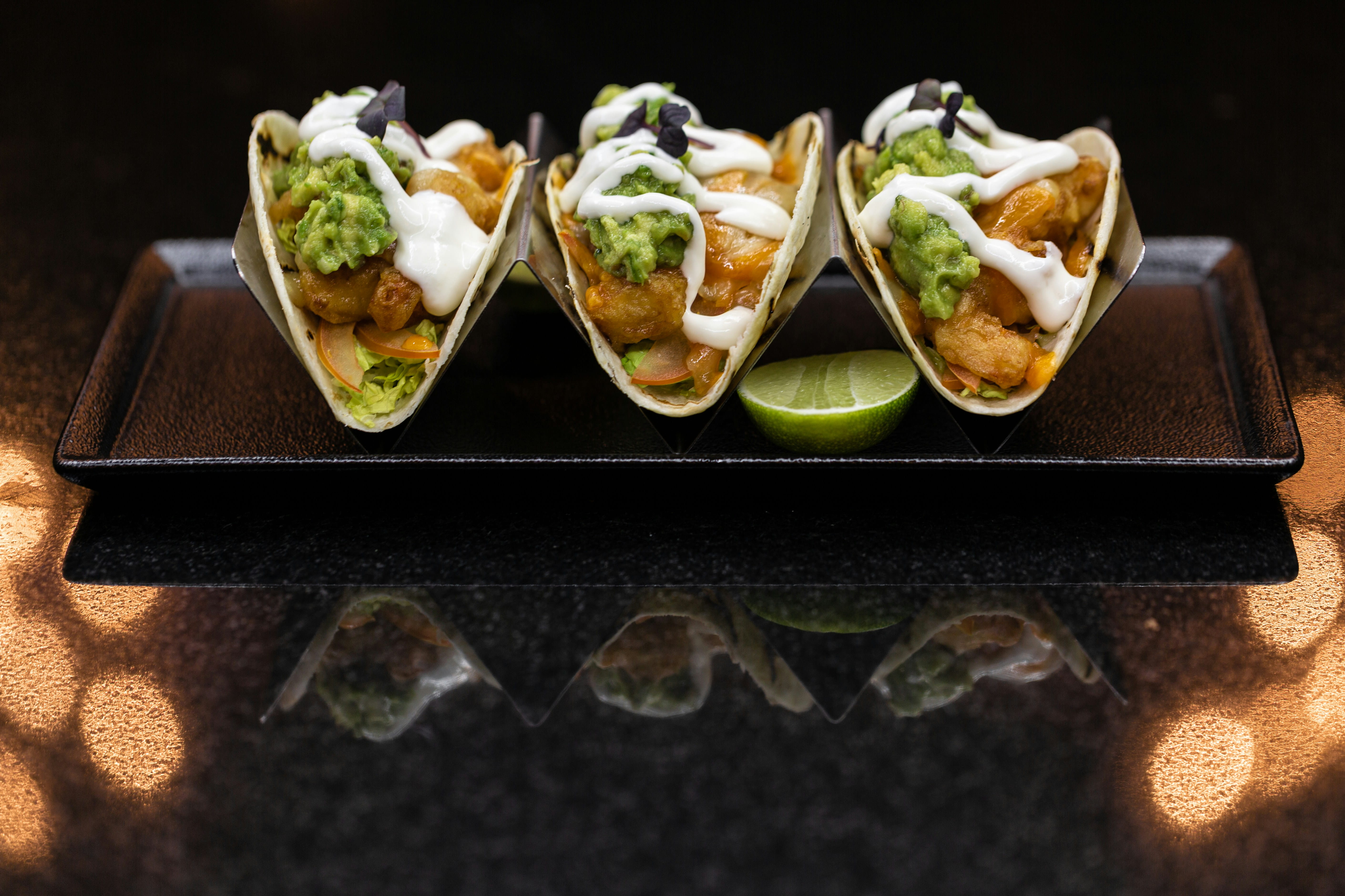 3 flying fish tacos plated