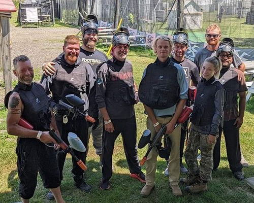 A photo of the Jeff's Outdoor team after playing paintball together.