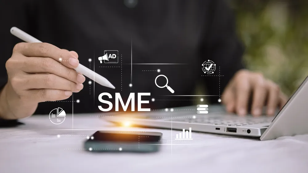 Person using digital pen with SME text and marketing icons