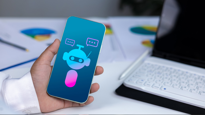 AI technology, virtual assistants, and digital customer service in a modern business environment. Close-up of hand holding smartphone with chatbot icon.