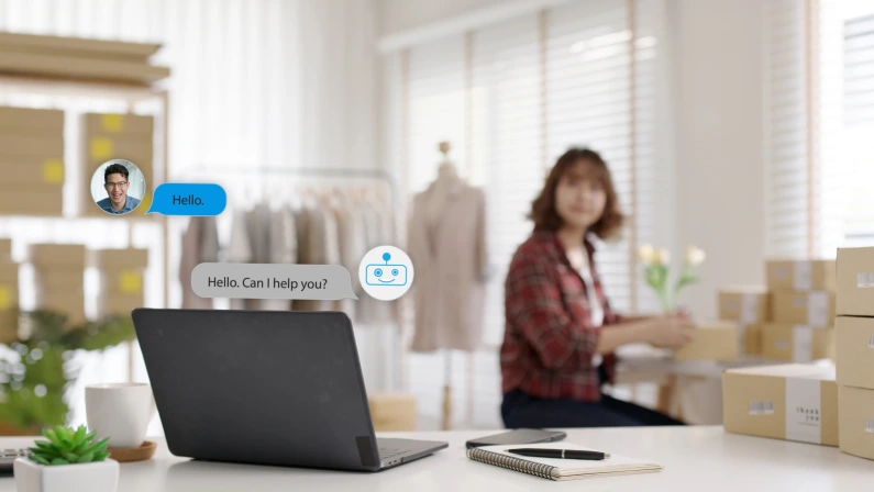 Chatbot conversation on laptop screen app interface with artificial intelligence technology providing virtual robotic assistant customer support and information for small business SME B2C concept.