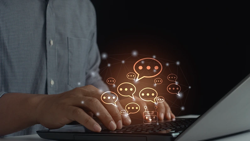 Businessman chatting with AI assistant bot through live message on laptop for client service and information support in digital business technology online communication using AI live chat conversation